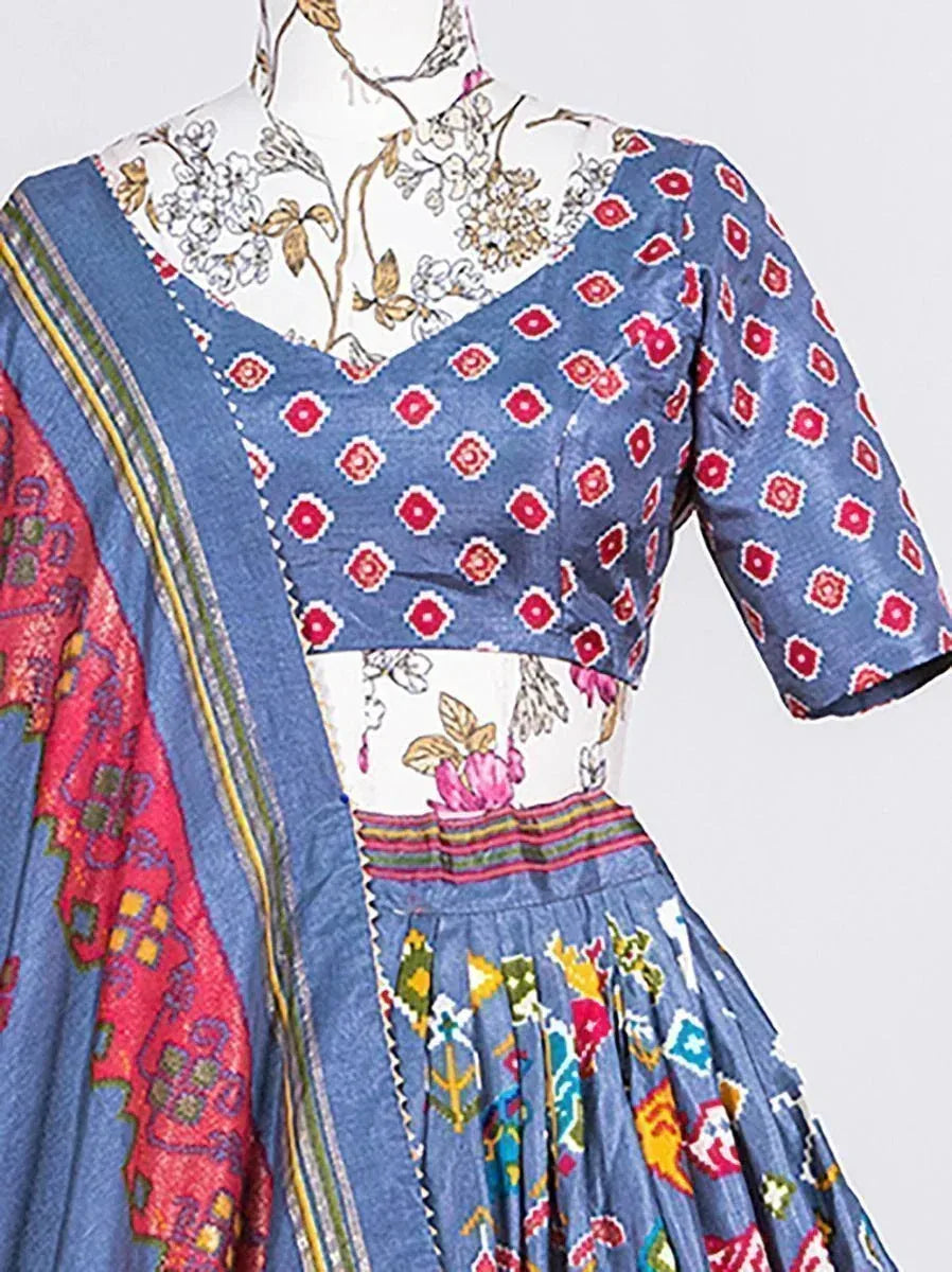 Blue printed ethnic gown with floral blouse and colorful dupatta, perfect for Indian occasions