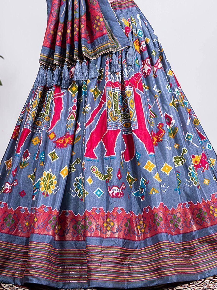 Blue ethnic skirt with red elephant print, tassels, and vibrant folk patterns for Indian wear