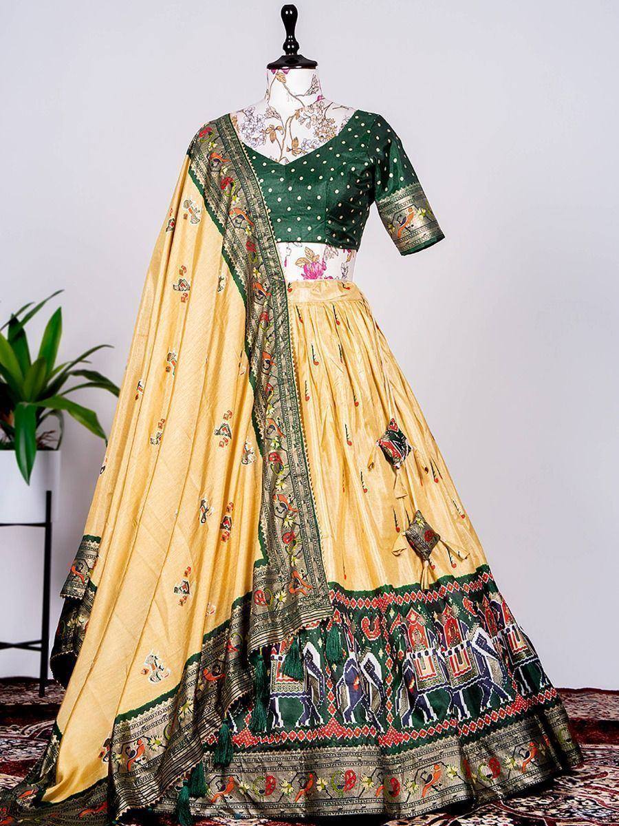 Yellow and green embroidered lehenga choli with elephant print, perfect for Indian ethnic wear occasions.