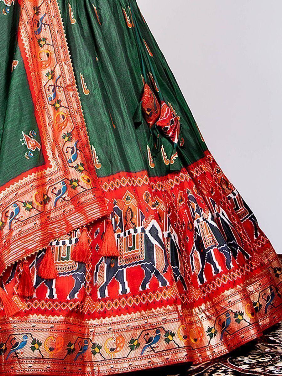 Green and red ethnic lehenga with elephant and bird motifs, traditional Indian wedding wear