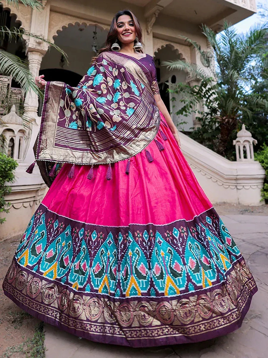 Vibrant pink and purple lehenga choli with peacock print, perfect for Indian ethnic wear occasions.