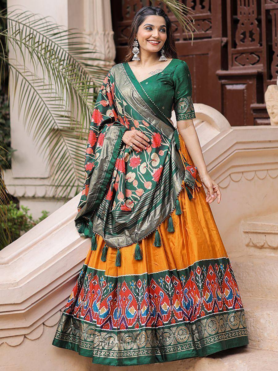 Green and orange floral printed lehenga choli with tassels, perfect for Indian ethnic wear occasions