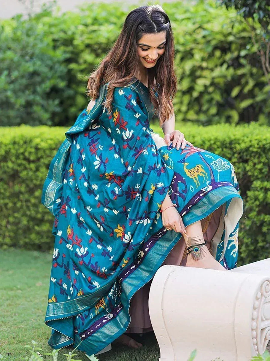 Teal floral print saree with deer motifs, styled for Indian ethnic wear, perfect for festive occasions