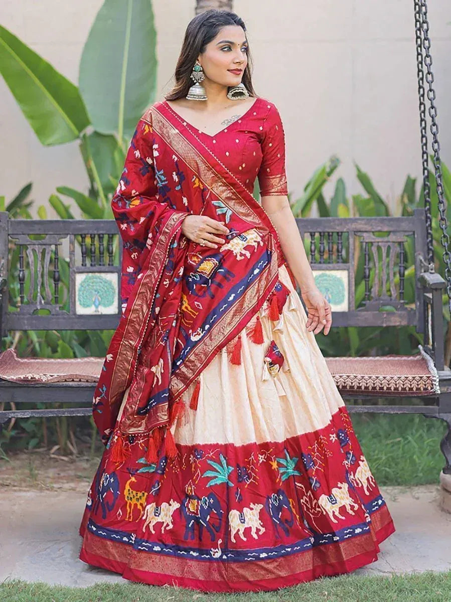 Red and cream printed lehenga choli with elephant motifs, perfect for Indian ethnic wear occasions