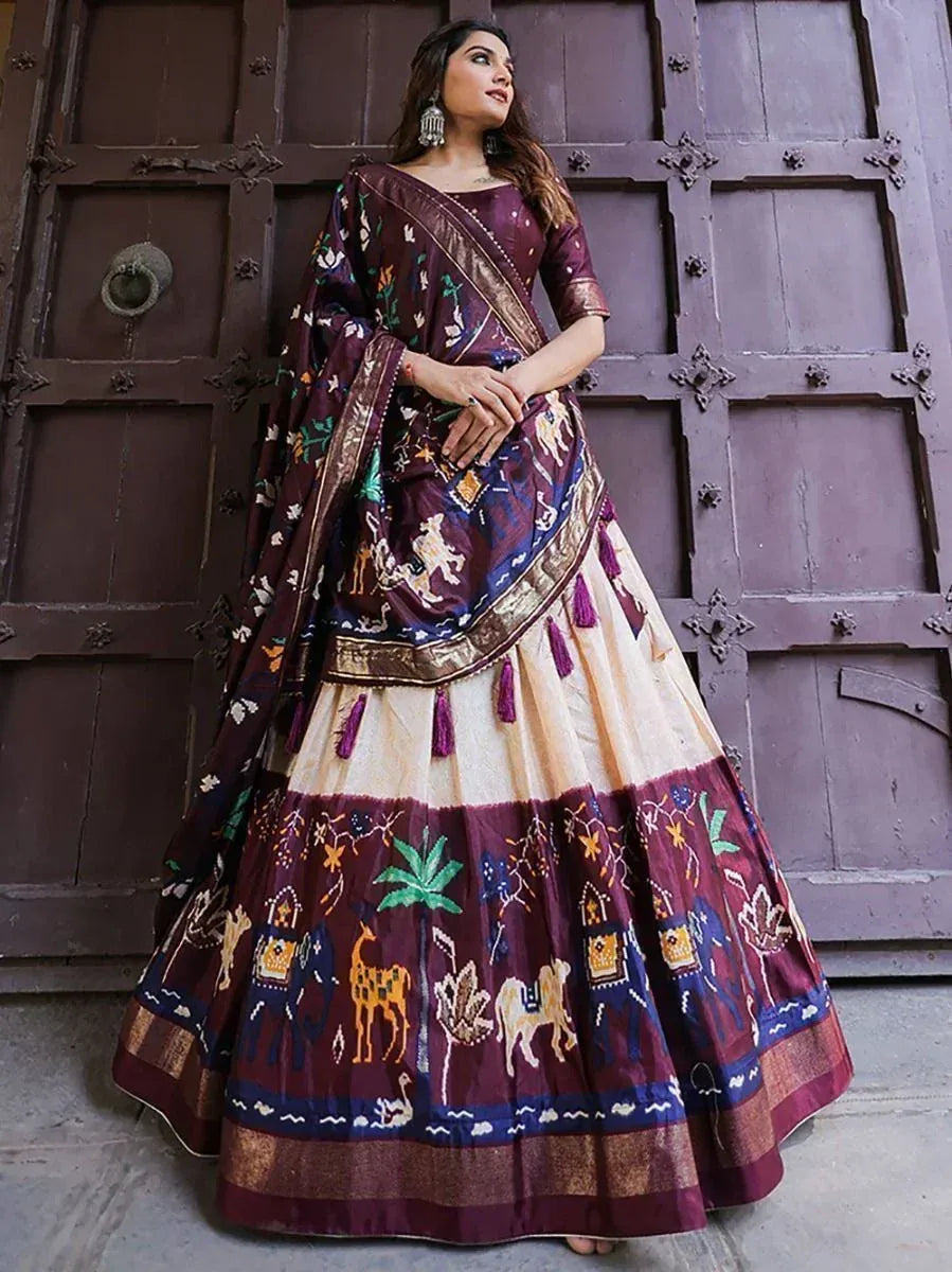 Elegant maroon and cream lehenga choli with animal and nature print, perfect for Indian ethnic occasions