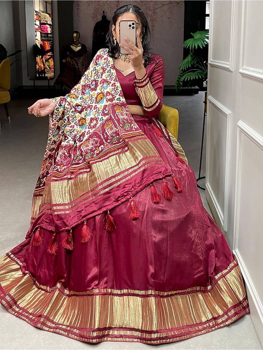 Maroon designer lehenga choli with embroidered dupatta and gold border, perfect for Indian ethnic occasions