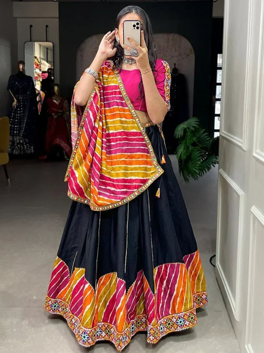 Vibrant pink and black lehenga choli with striped dupatta, perfect for Indian ethnic wear occasions