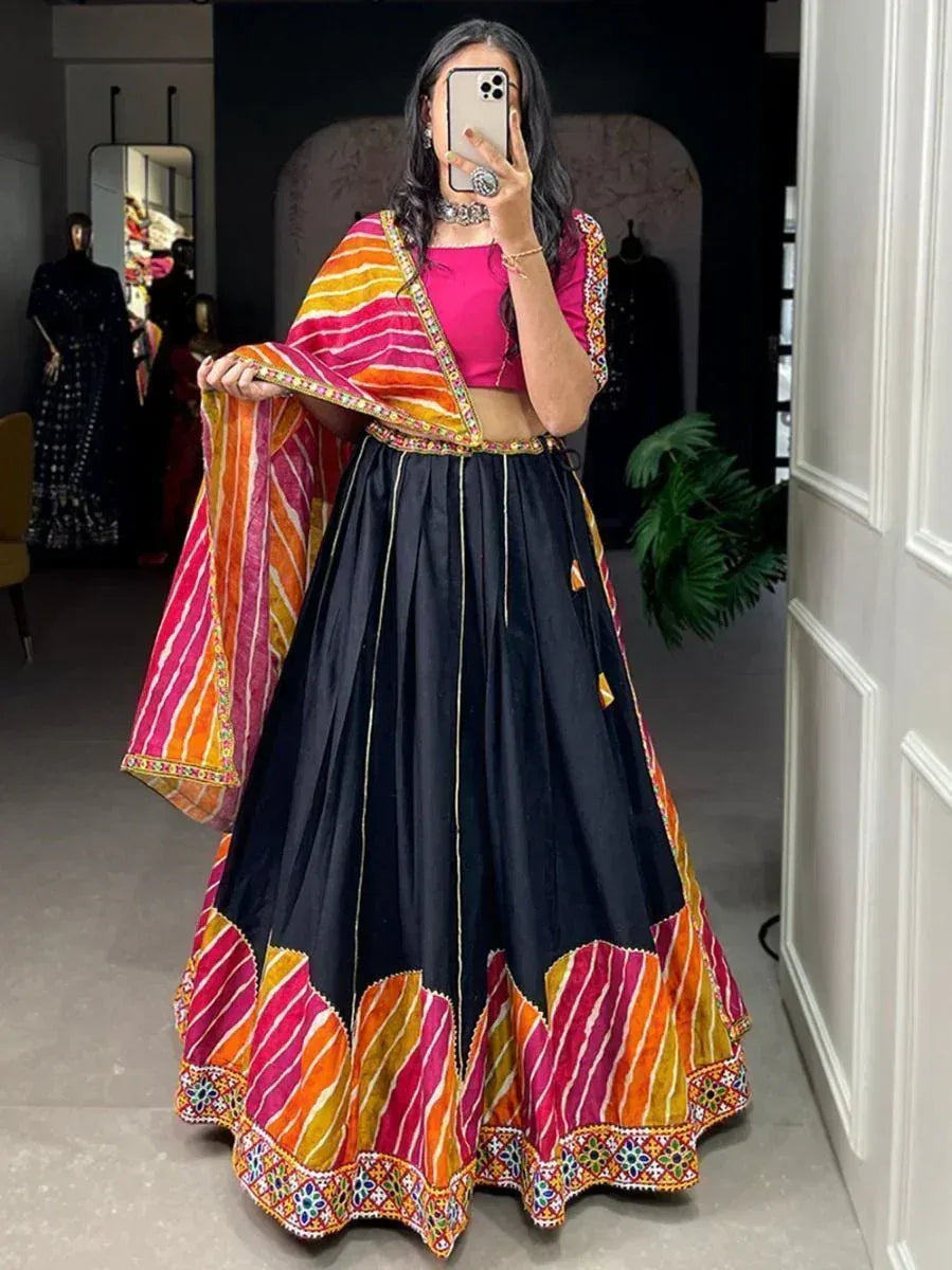 Black lehenga with colorful striped dupatta and embroidered border, perfect for Indian ethnic wear occasions