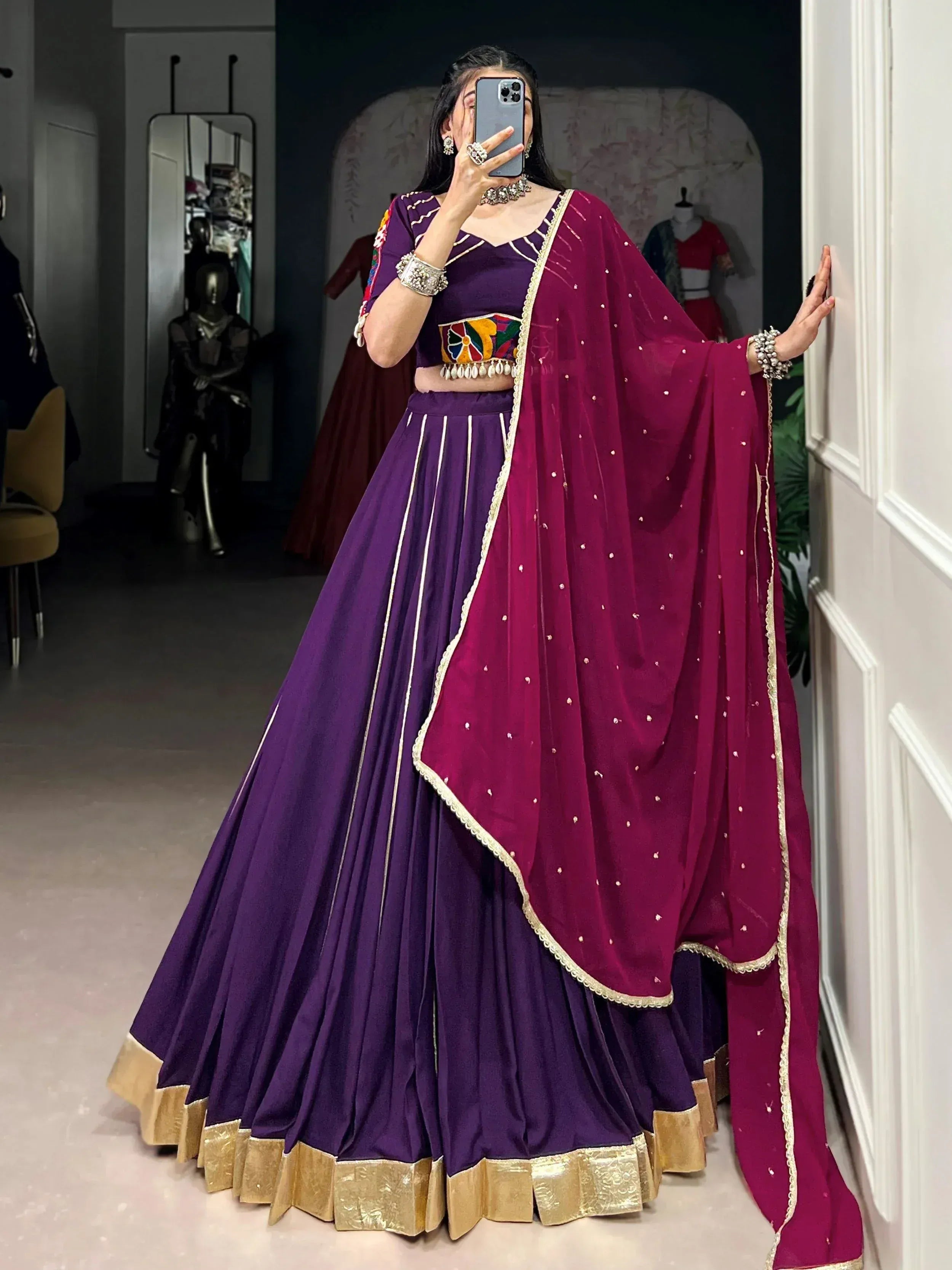 Purple lehenga choli with maroon dupatta, gold trim, and floral embroidery for Indian ethnic wear