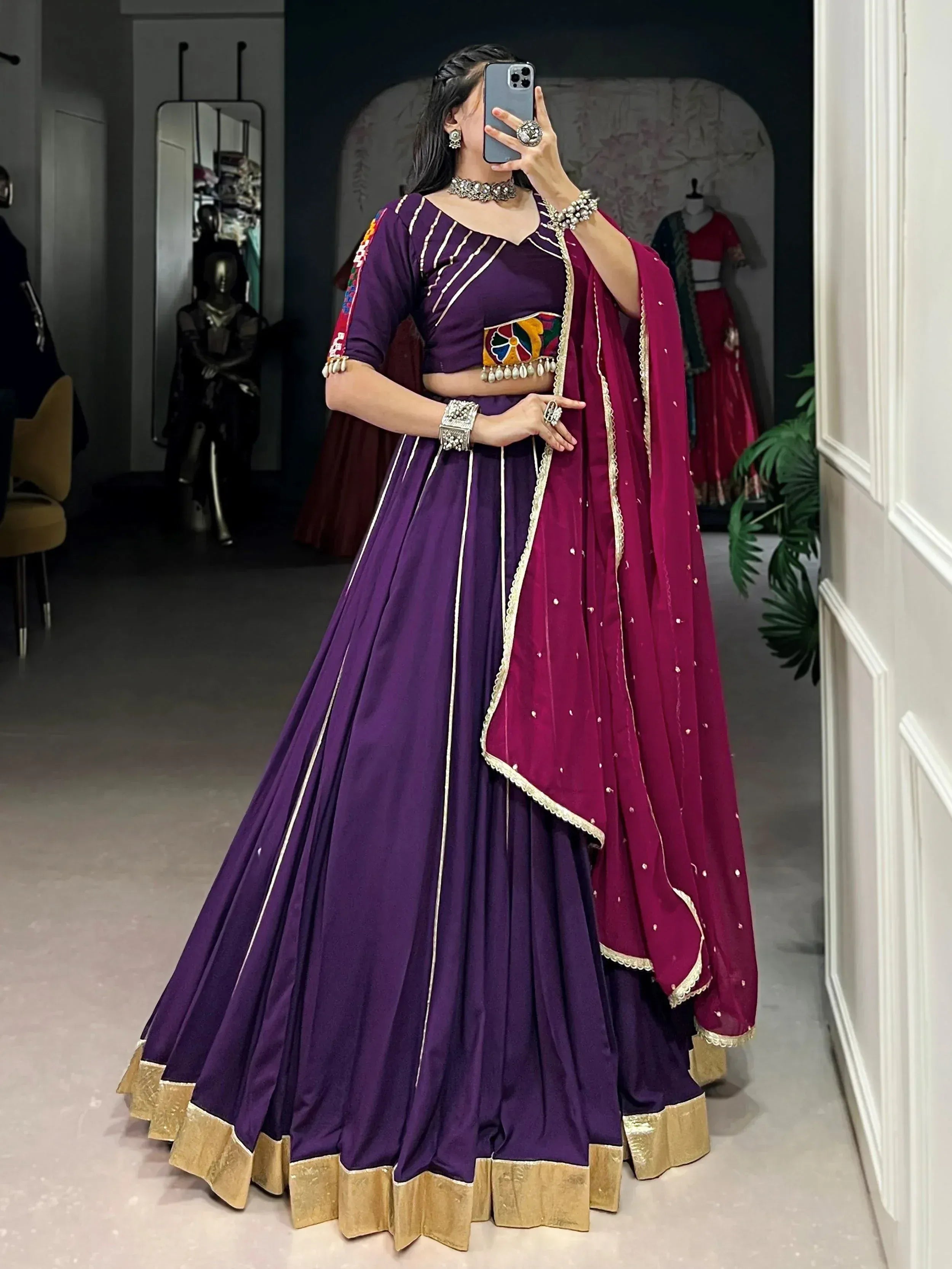 Purple lehenga choli with gold trim and maroon dupatta, ethnic Indian wear for weddings or festivals