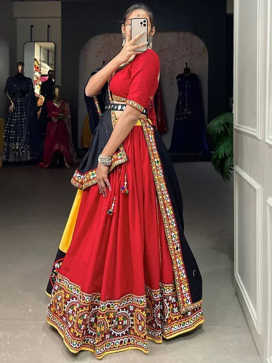 Red and black embroidered lehenga choli with mirror work, perfect for Indian ethnic wear occasions
