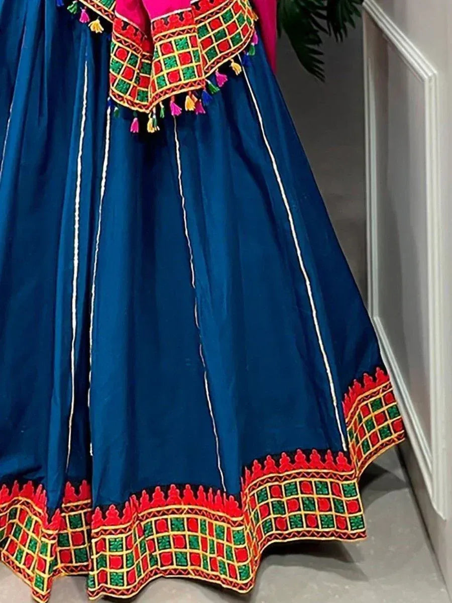 Blue ethnic lehenga with red green embroidery and tassels, Indian designer wear
