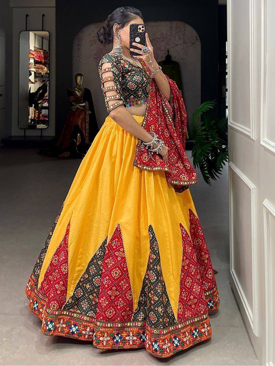 Vibrant yellow and red embroidered lehenga choli with mirror work, perfect for Indian ethnic occasions
