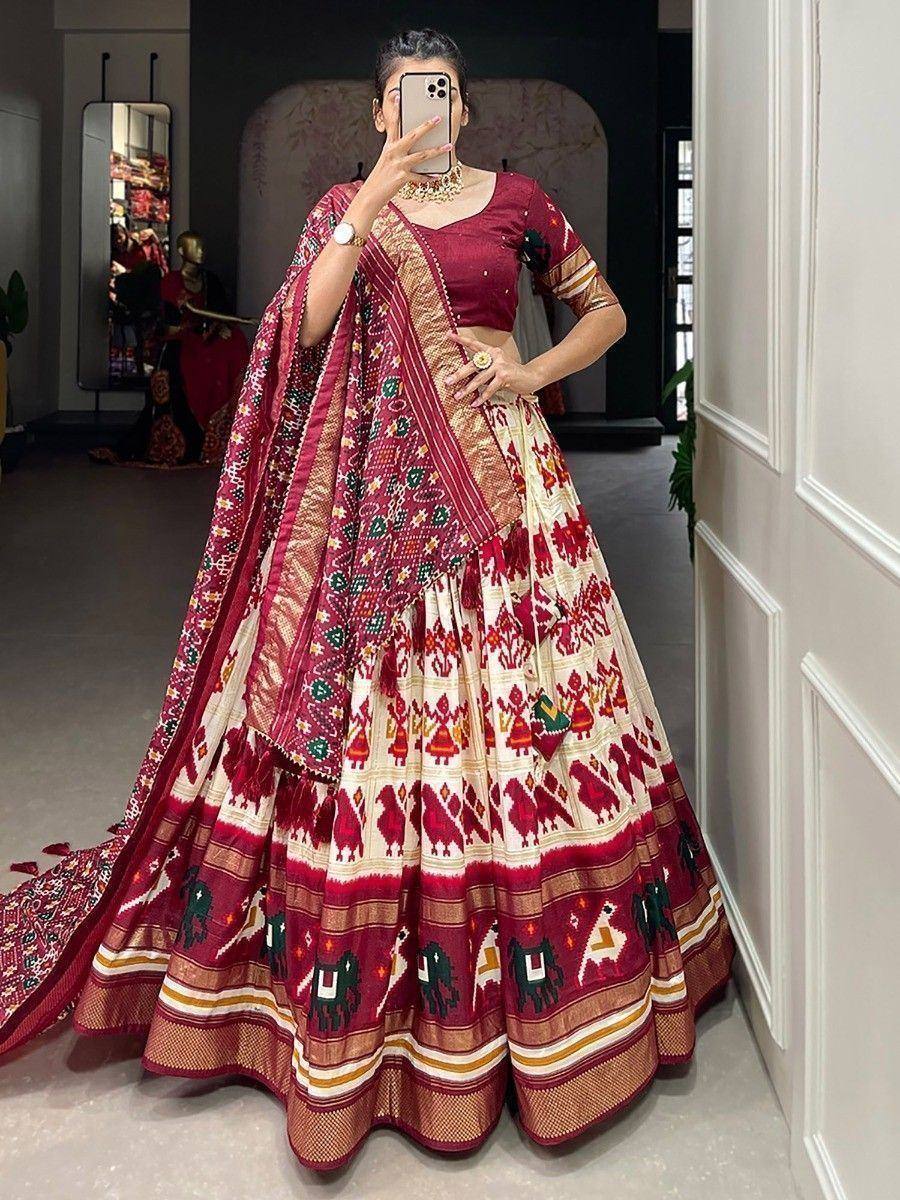Maroon and cream printed lehenga choli with ethnic motifs, perfect for Indian weddings and festive occasions.