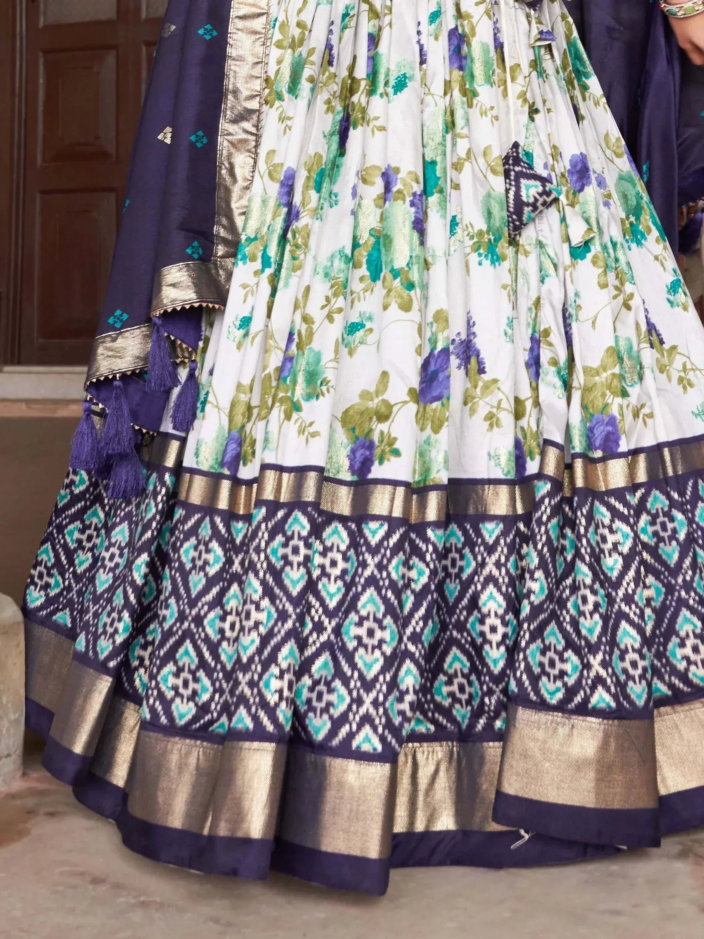White floral lehenga with purple ikat border and gold trim, Indian ethnic wear