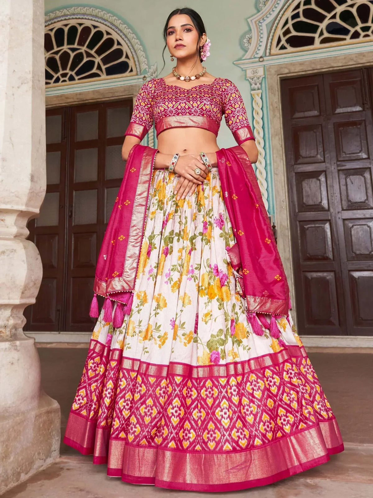 Pink and white floral lehenga choli with geometric border, perfect for Indian ethnic wear occasions