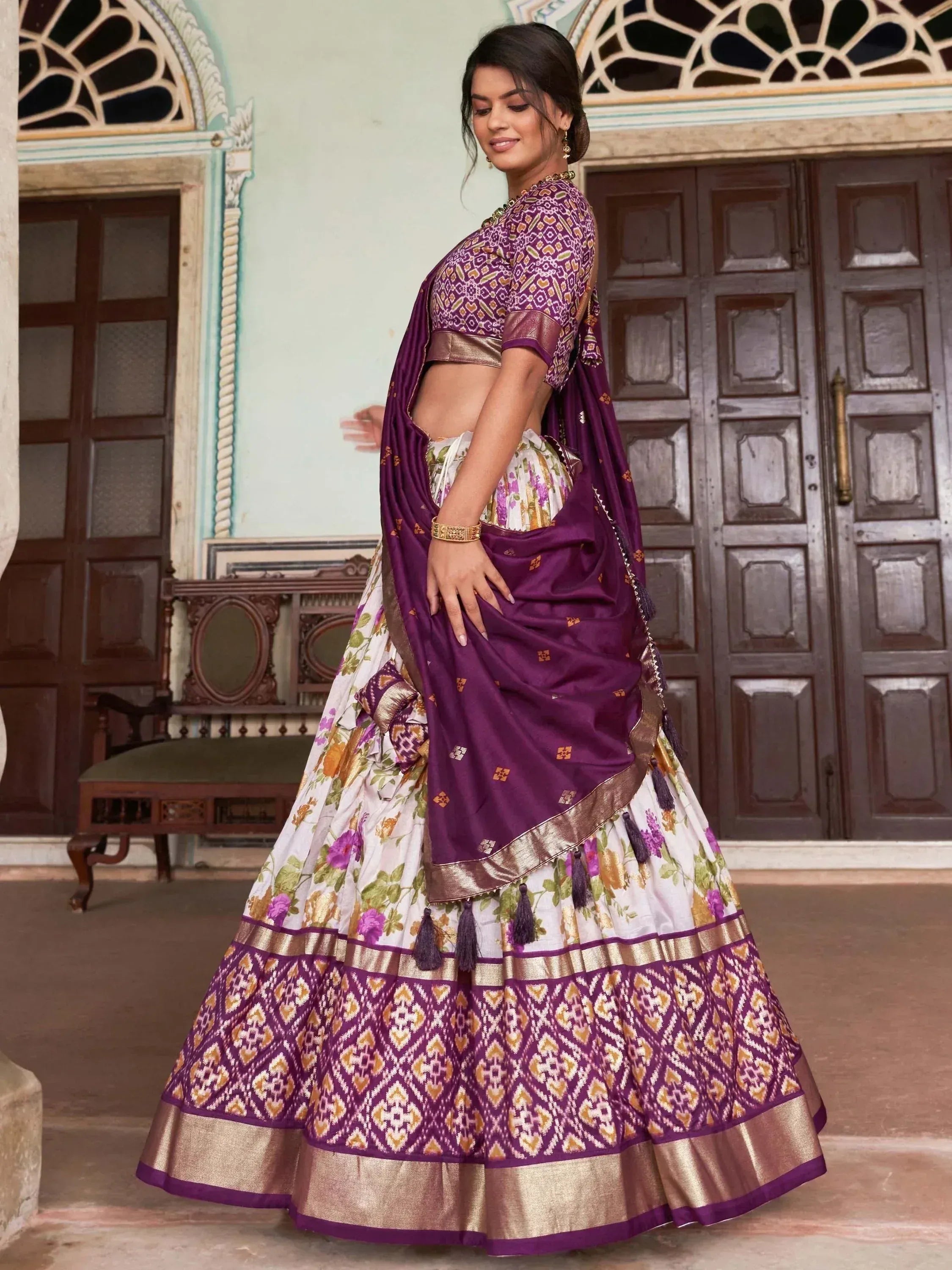 Purple and white floral lehenga choli with gold border, perfect for Indian ethnic wear occasions