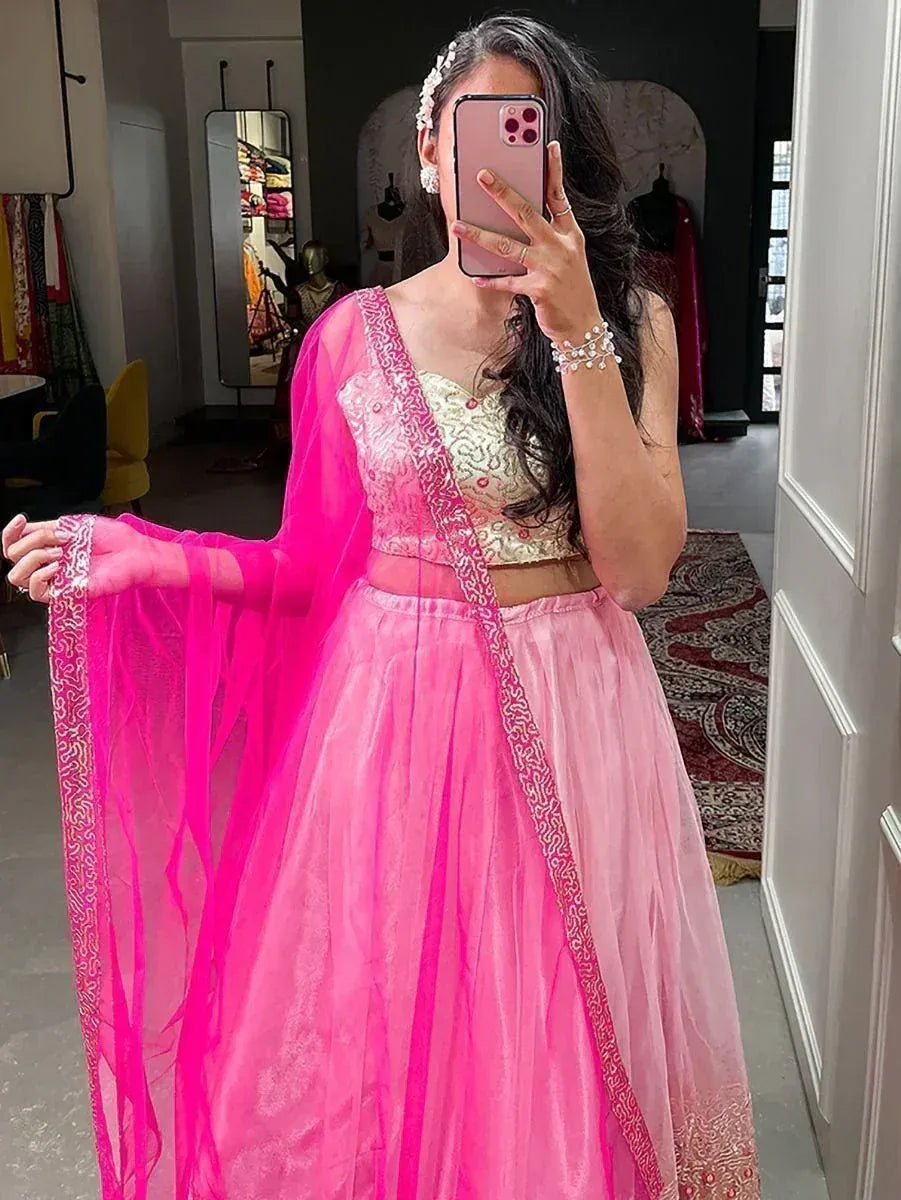 Pink lehenga choli with gold embroidery and sheer dupatta, perfect for Indian ethnic wear occasions