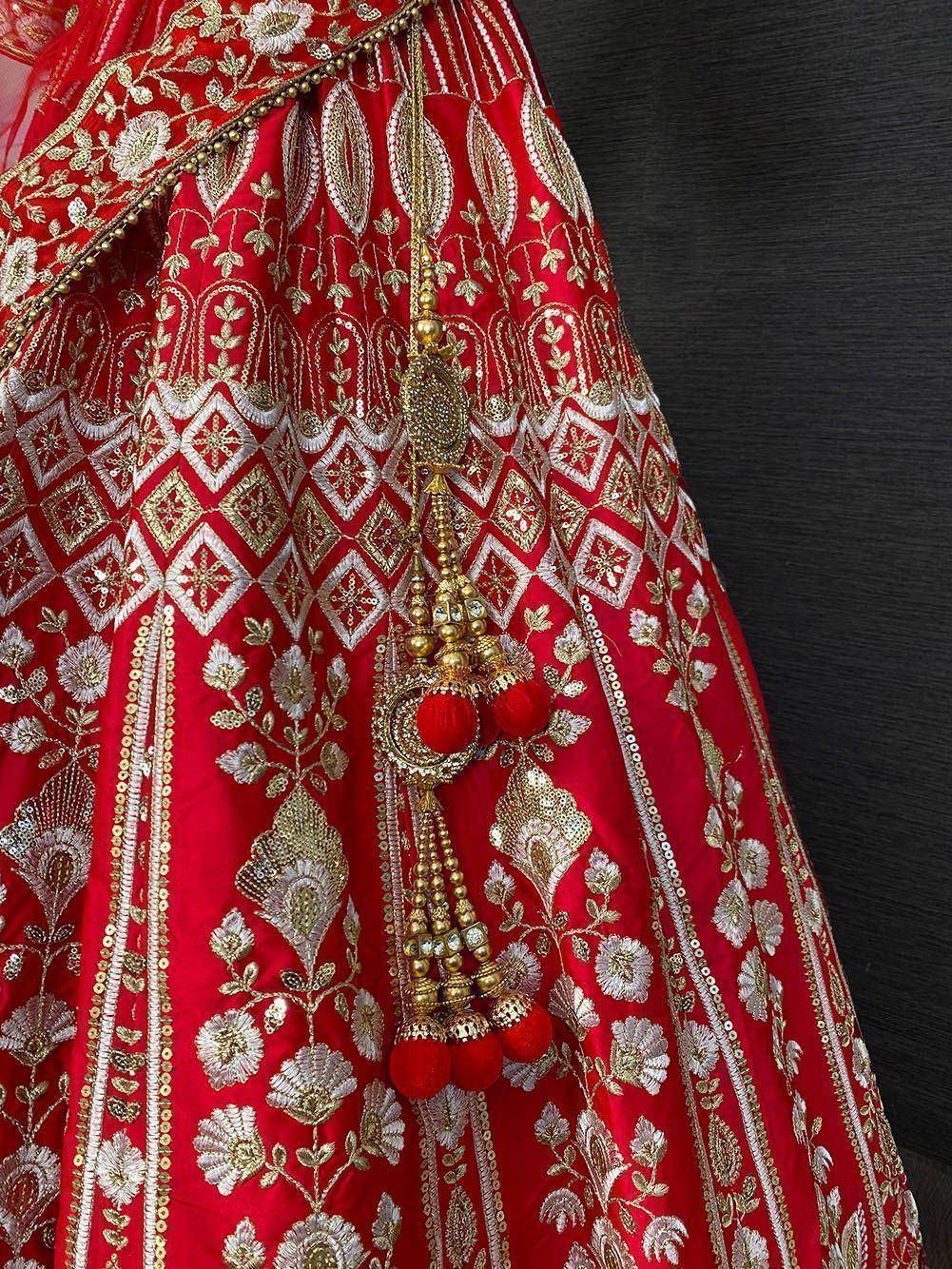 Red designer lehenga with gold embroidery and tassels, Indian ethnic wear