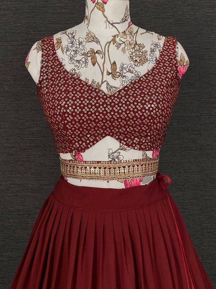 Maroon ethnic lehenga choli with gold sequin blouse and pleated skirt, perfect for Indian weddings