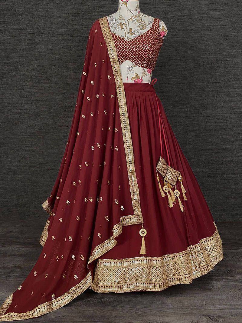 Maroon designer lehenga choli with gold embroidery and tassels, ethnic Indian wear