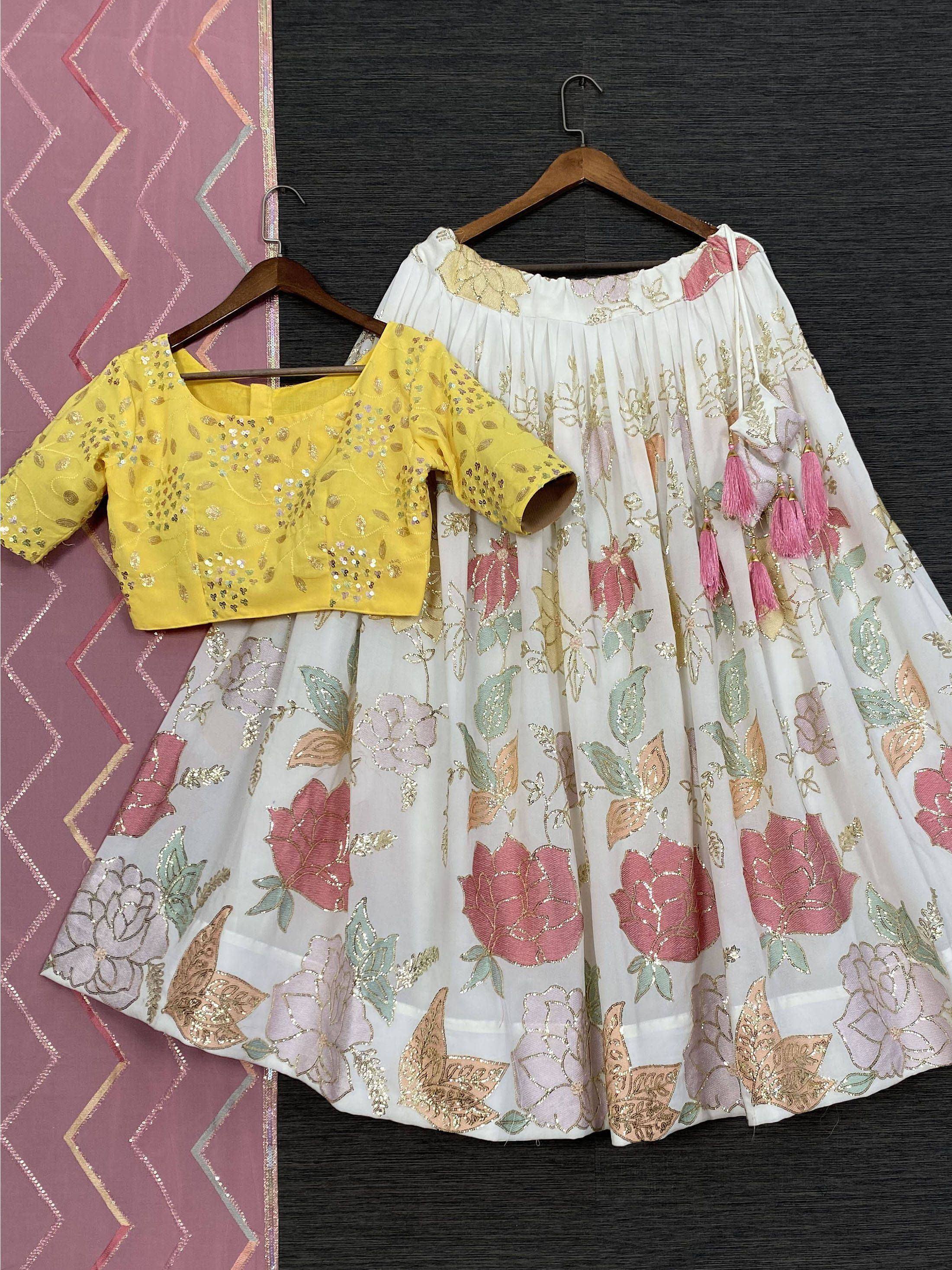 Yellow sequin blouse with white floral lehenga, pink tassels, ethnic wear for women