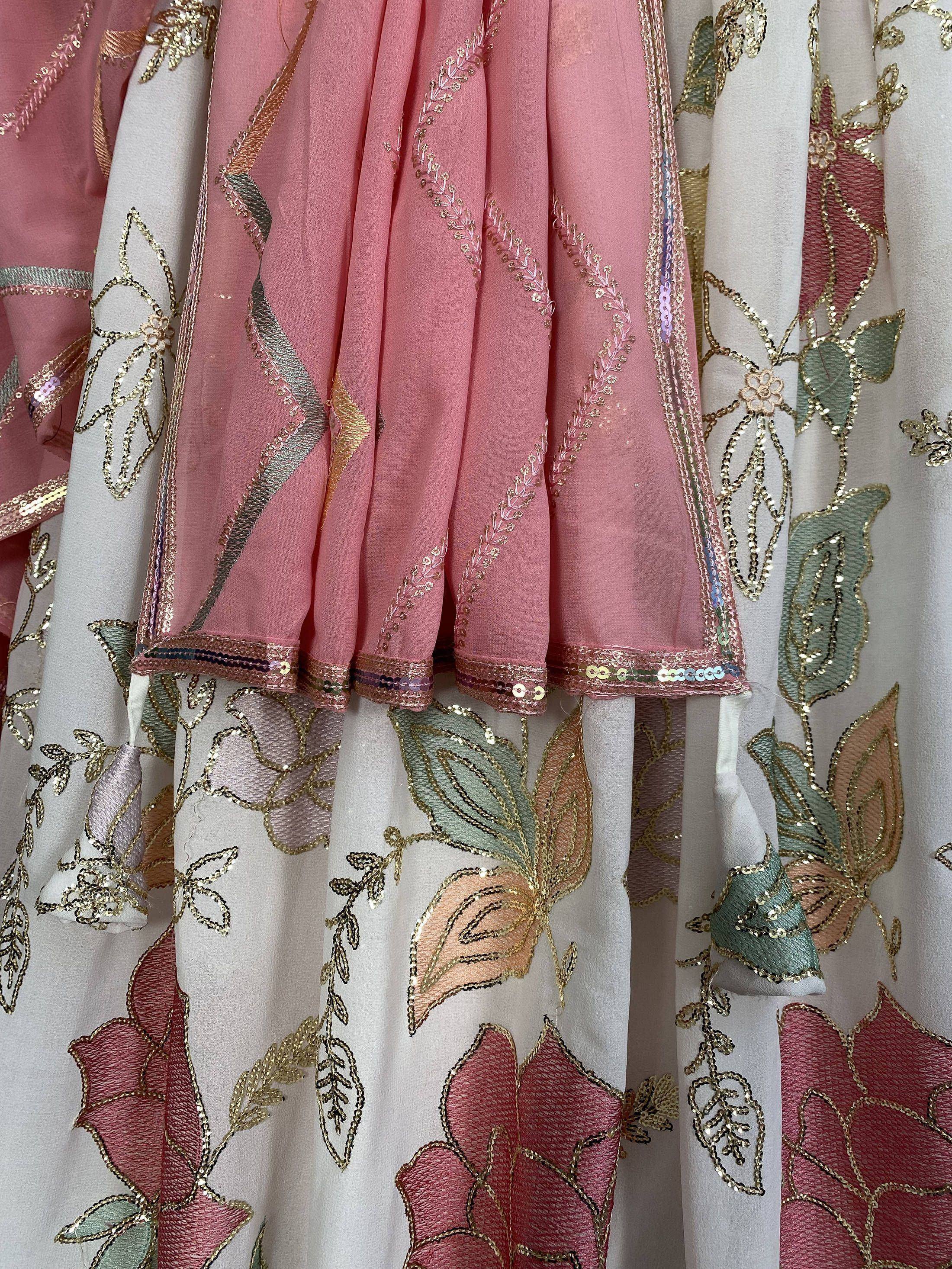 Pink and white embroidered ethnic wear with floral gold sequin detailing, perfect for Indian celebrations
