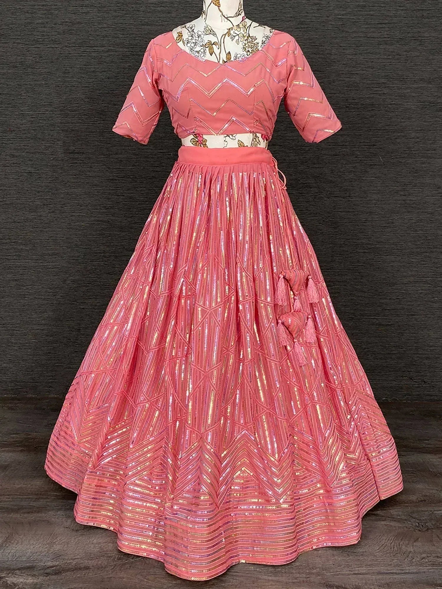 Pink designer lehenga choli with zigzag sequin work and tassels, ethnic Indian wear