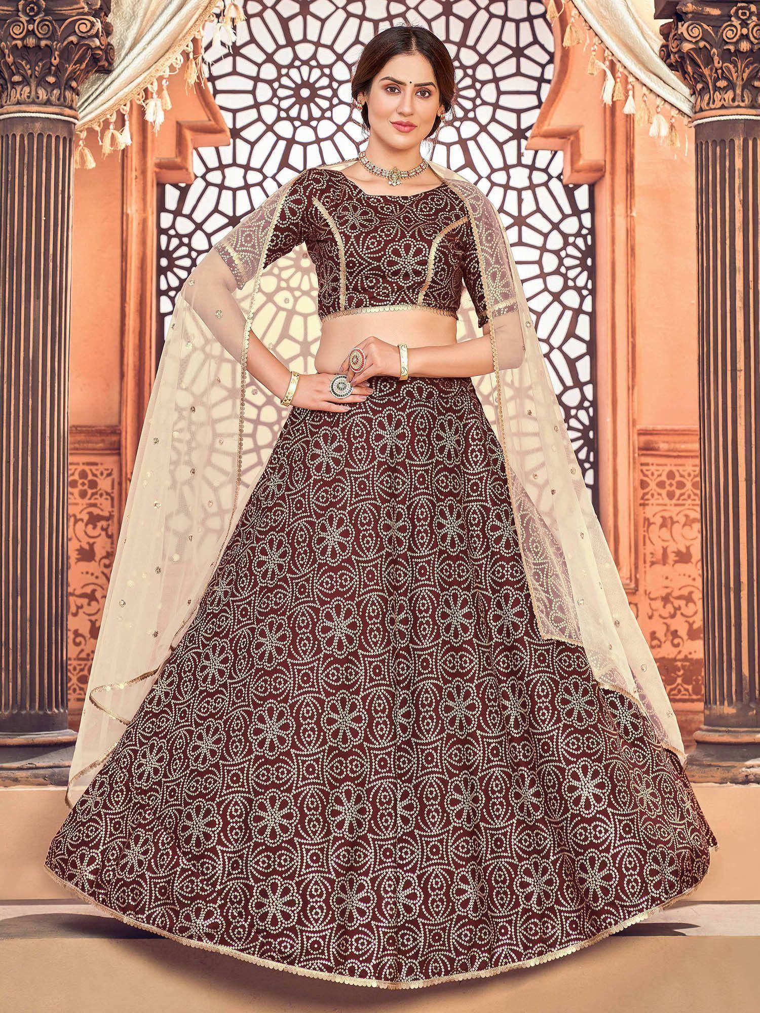 Elegant maroon lehenga choli with intricate gold embroidery and sheer dupatta for Indian ethnic wear