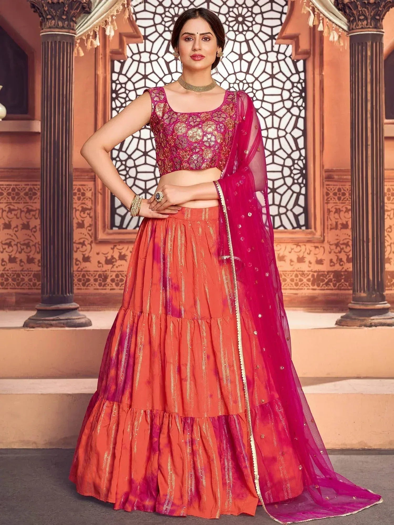 Pink and orange embroidered lehenga choli with sheer dupatta, traditional Indian ethnic wear for women
