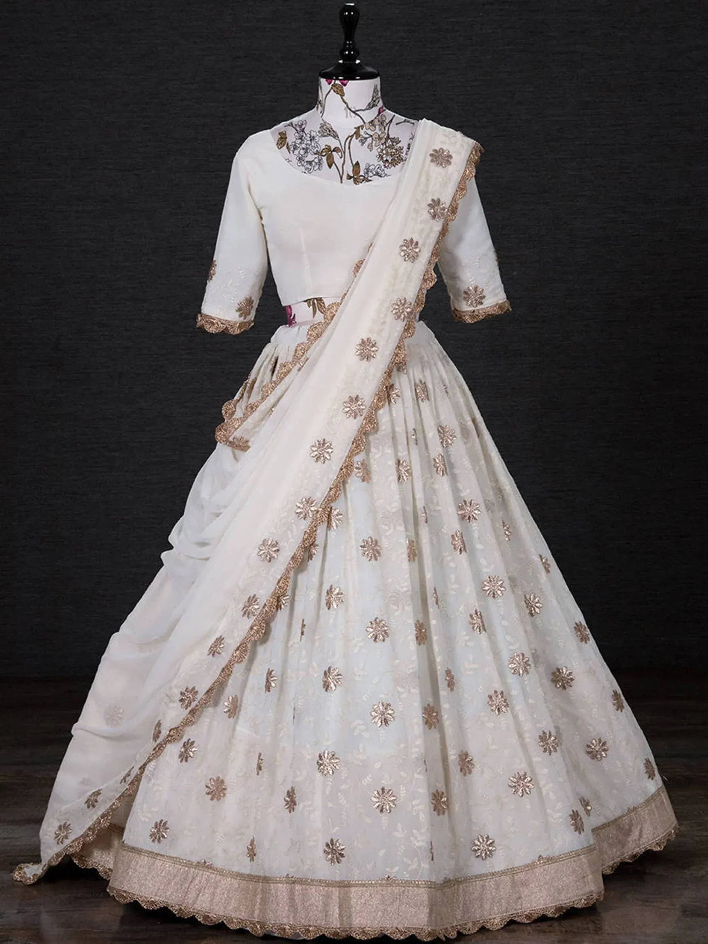 White designer lehenga choli with gold floral embroidery and dupatta, ethnic Indian wear for women