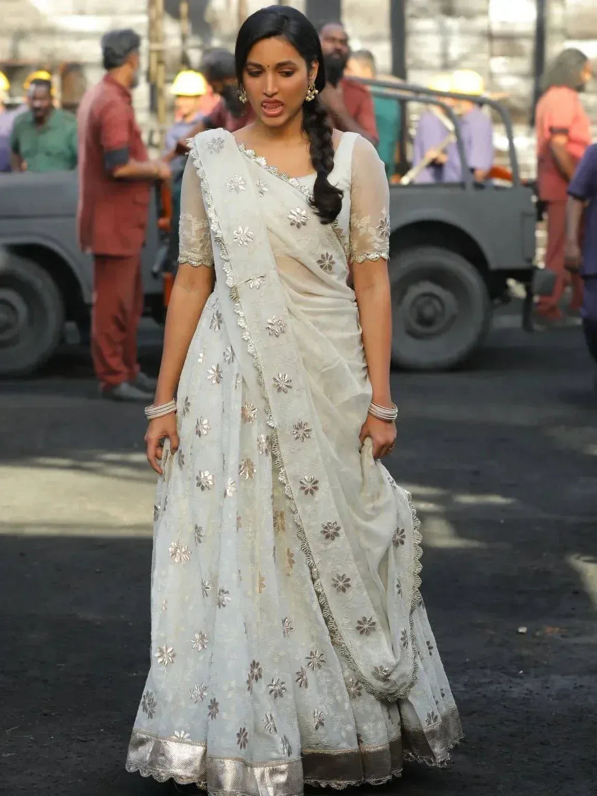 Elegant white saree with silver floral embroidery, perfect for Indian ethnic occasions