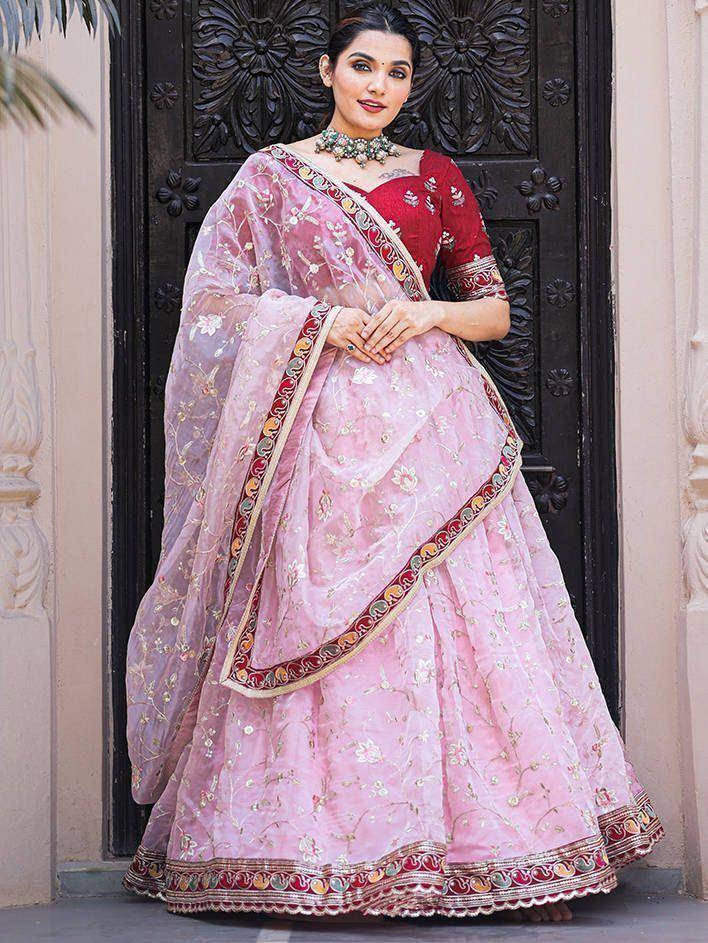 Pink embroidered lehenga choli with red blouse, perfect for Indian weddings and festive occasions