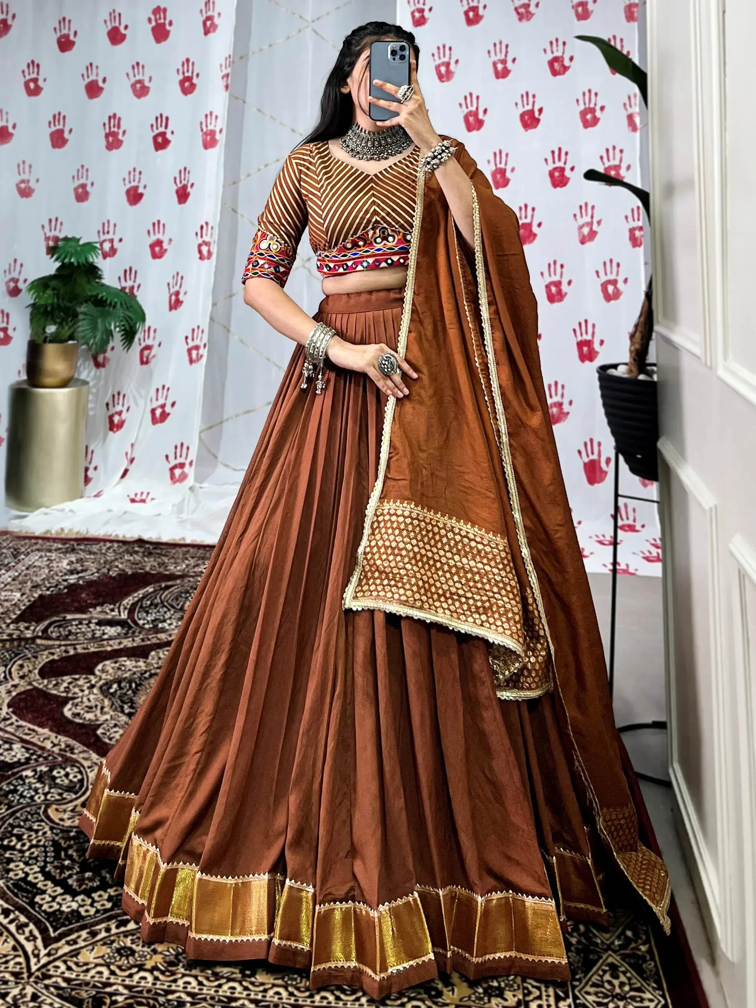 Brown embroidered lehenga choli with gold trim, traditional Indian ethnic wear for women