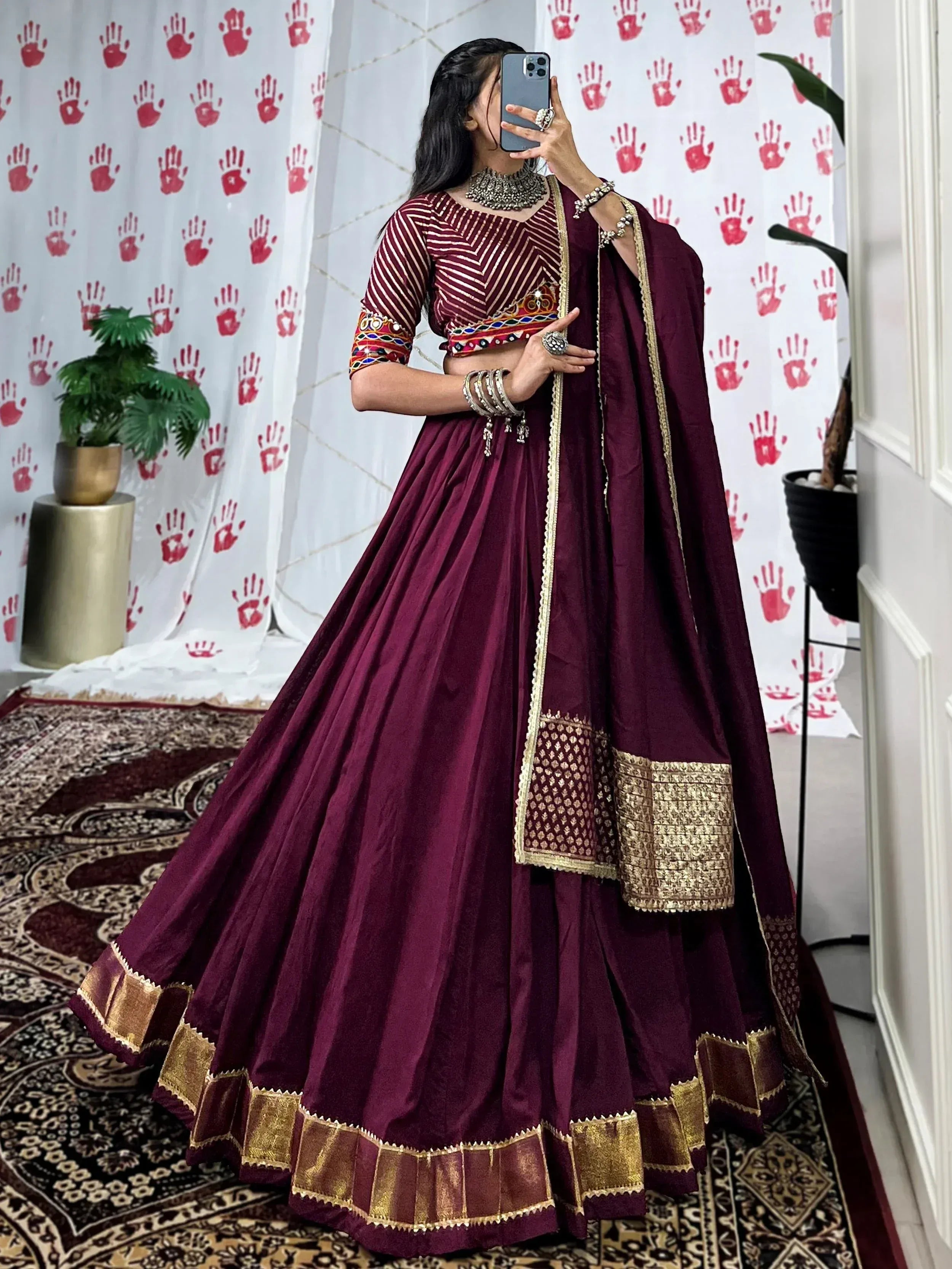 Maroon lehenga choli with gold embroidery, perfect for Indian ethnic wear and festive occasions.