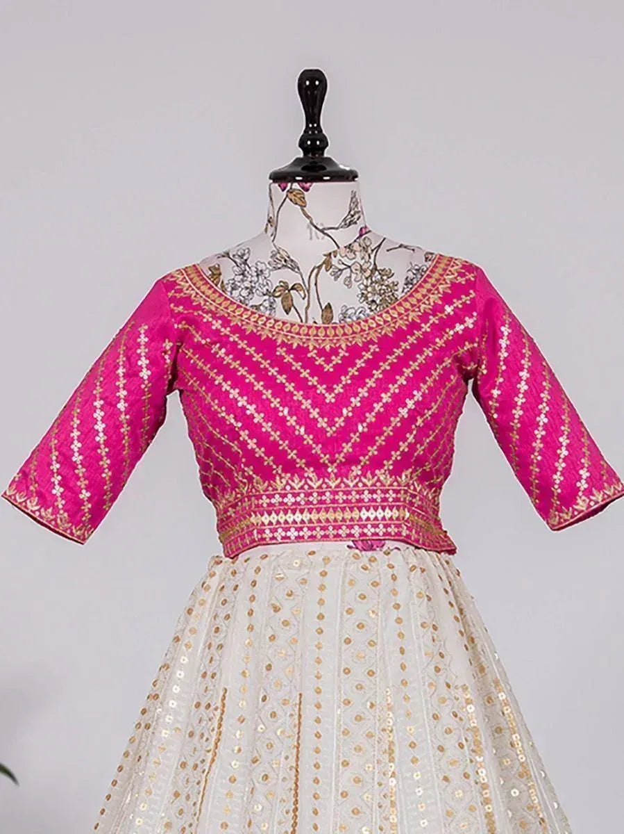 Pink and gold embroidered lehenga choli with floral neckline, perfect for Indian ethnic wear occasions