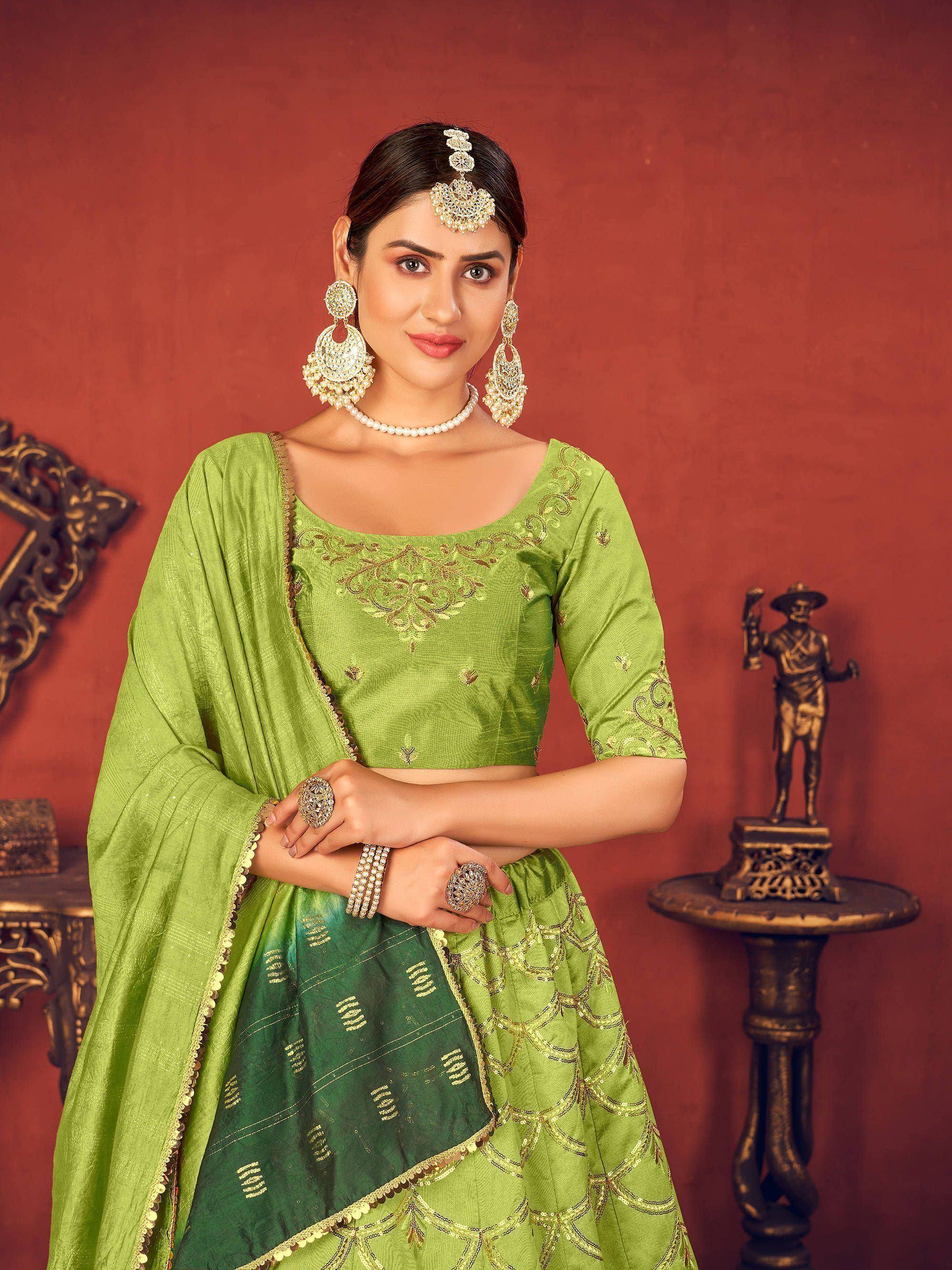 Green embroidered lehenga choli with gold detailing, perfect for Indian ethnic wear and festive occasions.