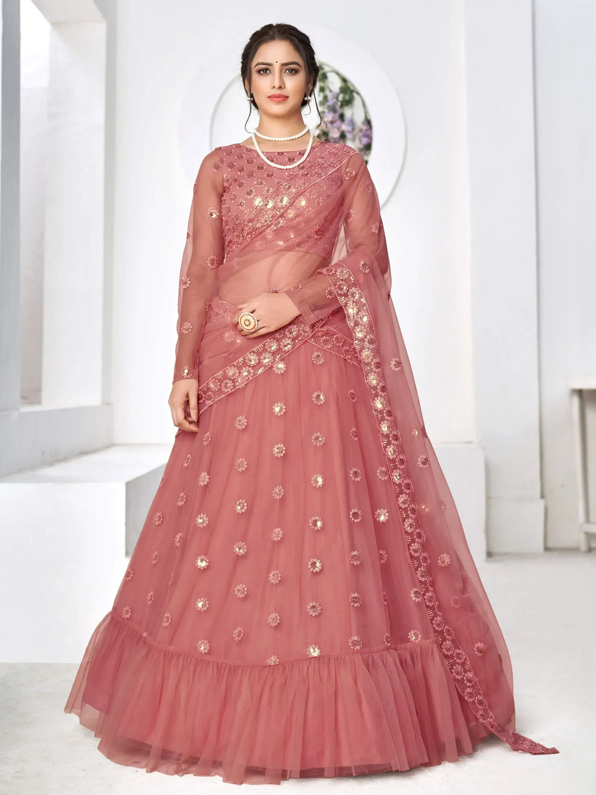 Dusty pink embroidered lehenga choli with sheer dupatta, perfect for Indian weddings and festive occasions
