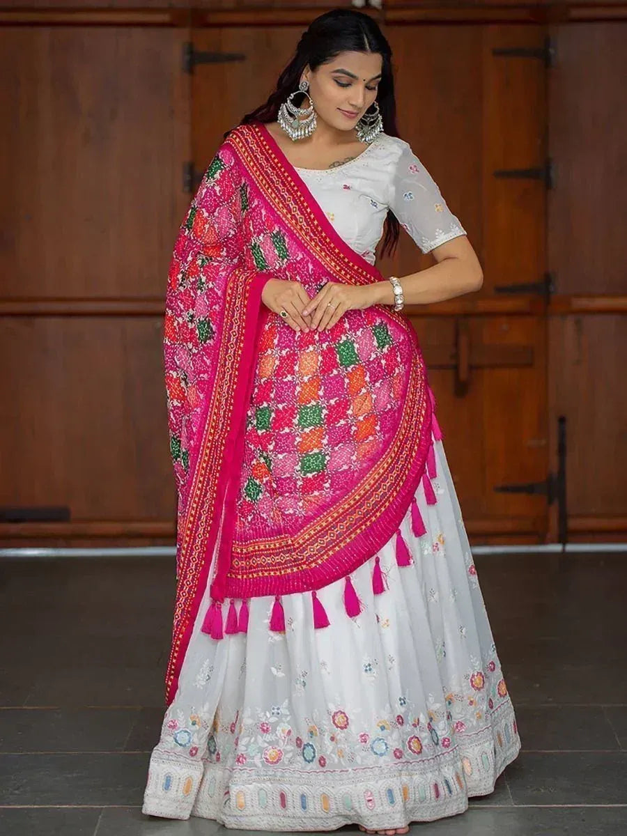 White embroidered lehenga with vibrant pink dupatta, perfect for Indian ethnic occasions