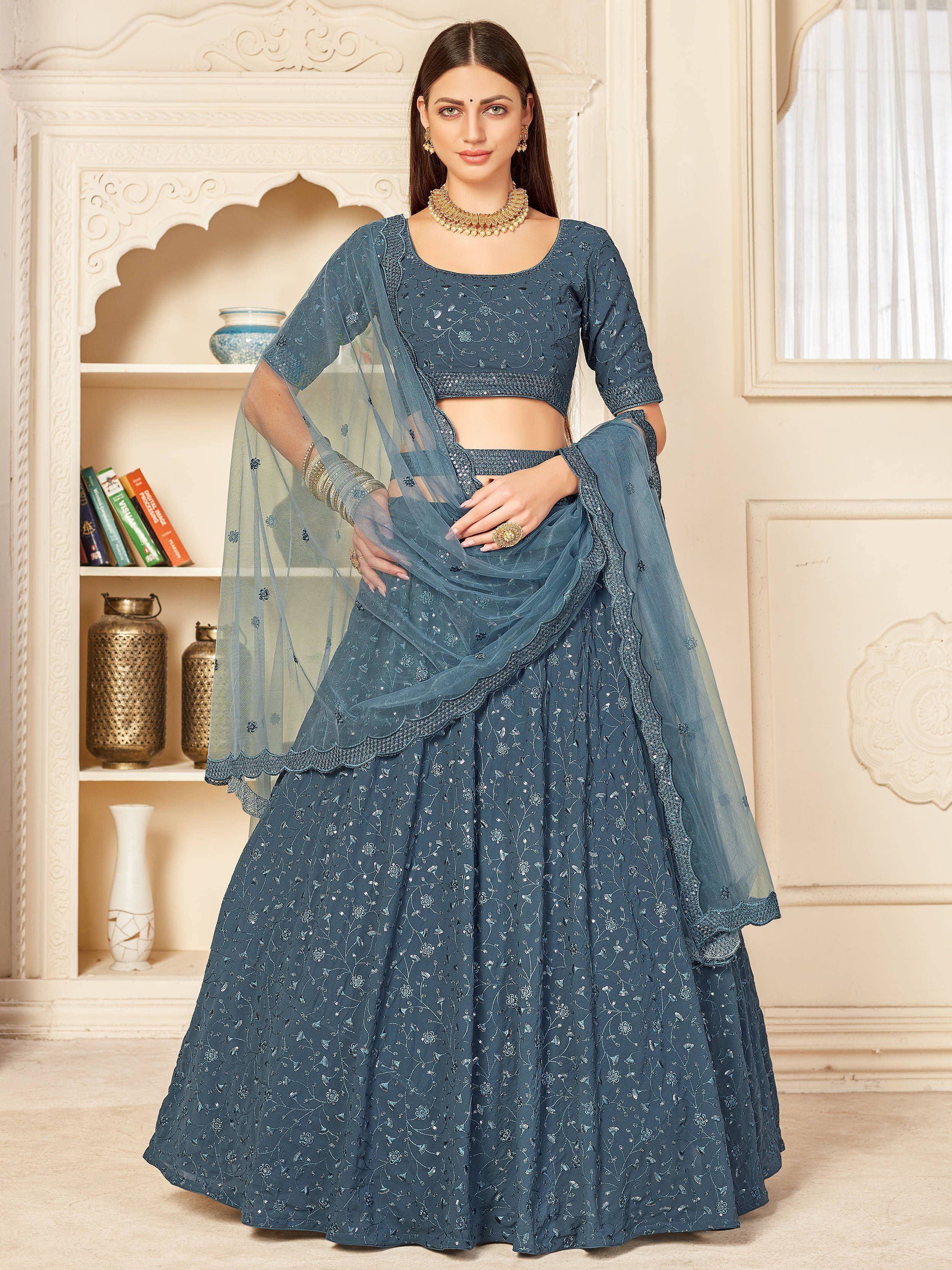 Blue embroidered lehenga choli with sheer dupatta, perfect for Indian ethnic wear and festive occasions.