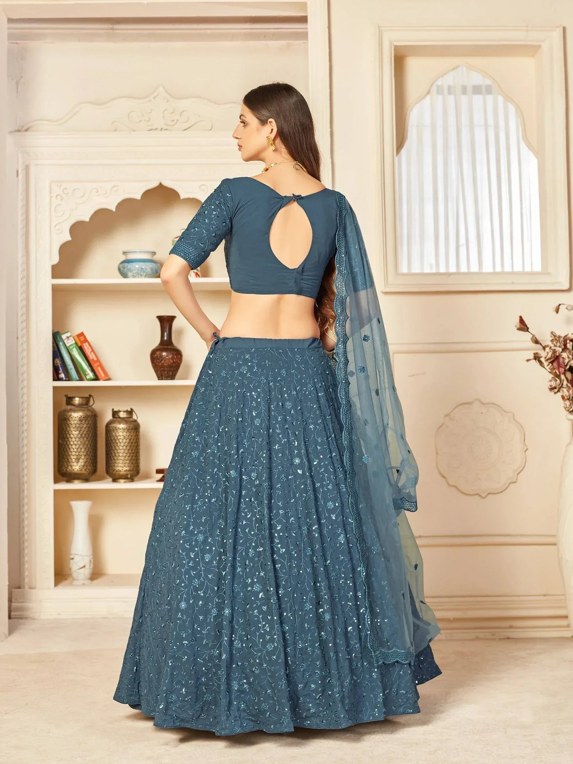 Blue embroidered lehenga choli with back cutout and sheer dupatta, Indian ethnic wear
