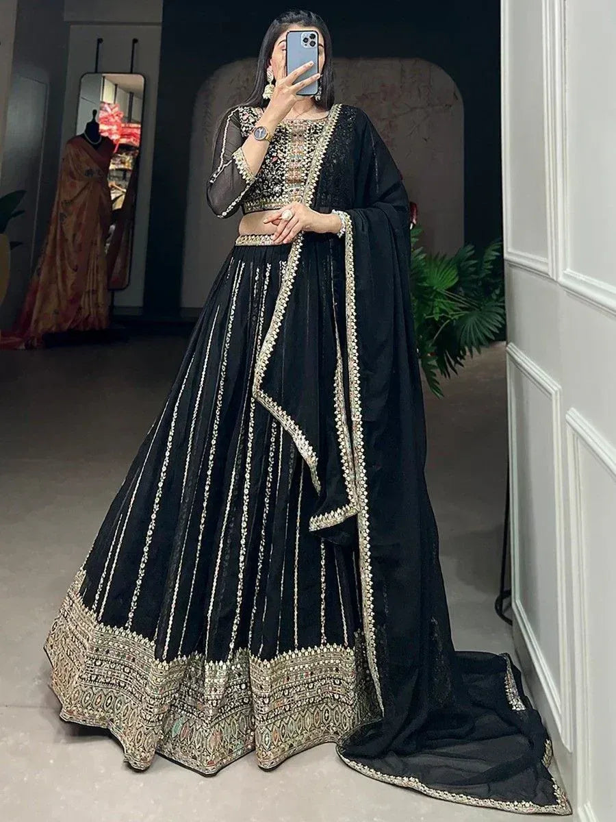 Black embroidered lehenga choli with gold detailing, perfect for Indian ethnic wear and festive occasions.