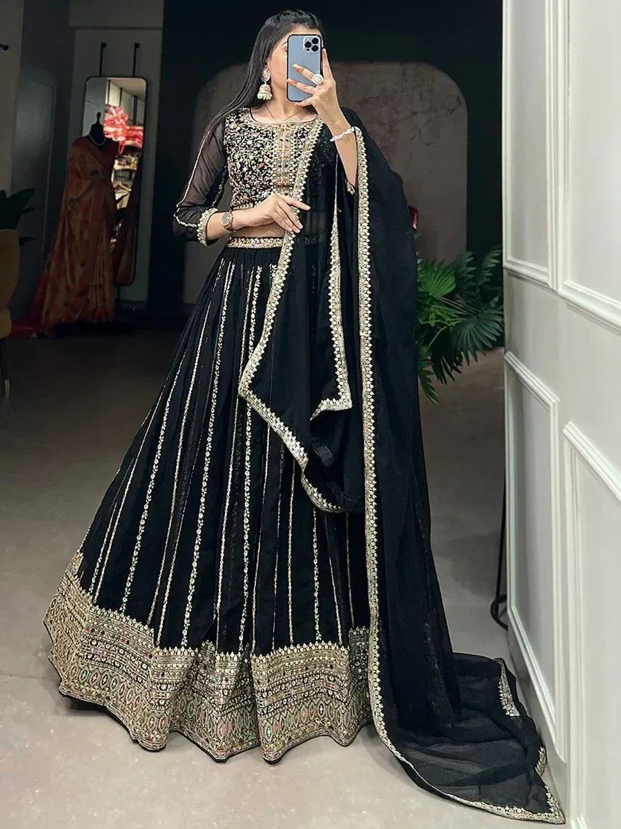 Black embroidered lehenga choli with gold detailing, perfect for weddings and festive occasions.