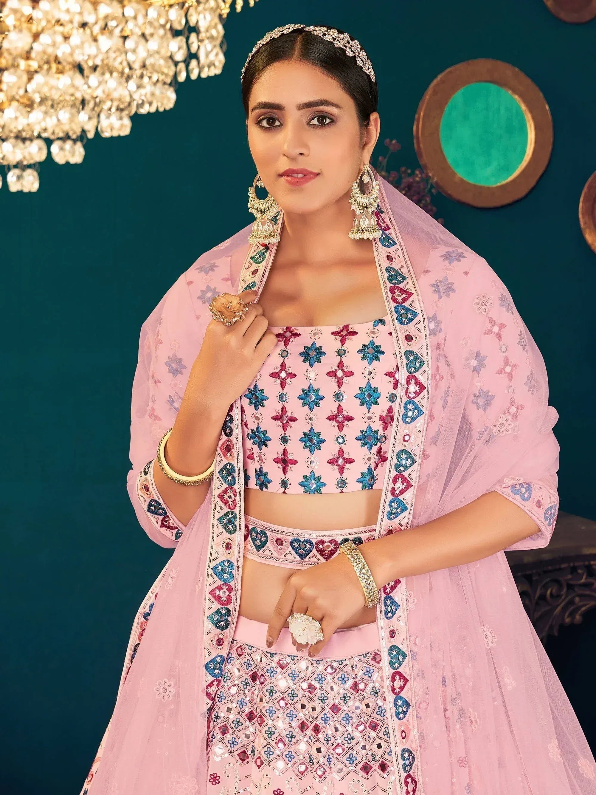 Pink embroidered lehenga choli with mirror work, perfect for Indian ethnic wear and festive occasions.