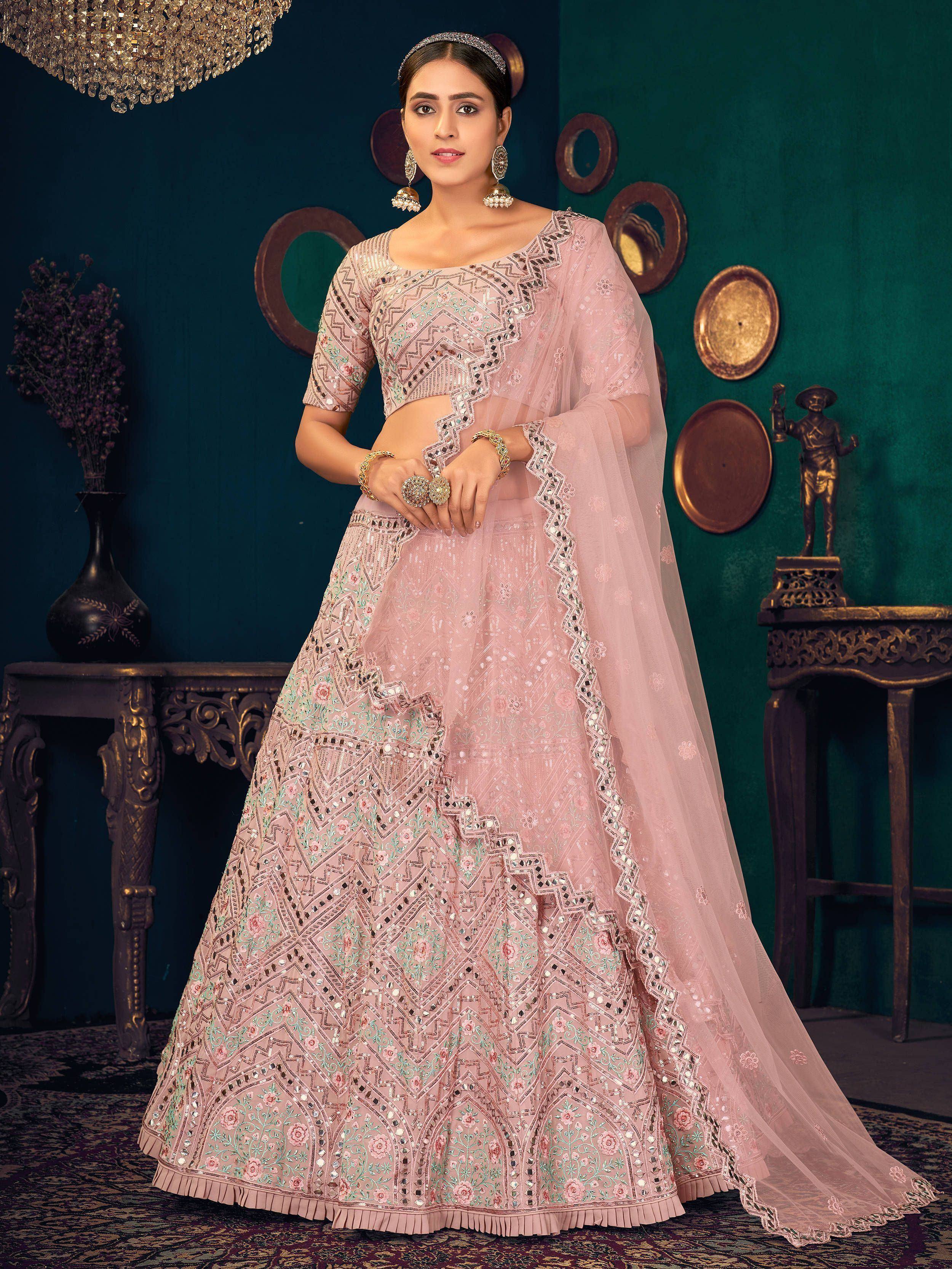 Elegant pink embroidered lehenga choli with mirror work and floral patterns for Indian ethnic wear