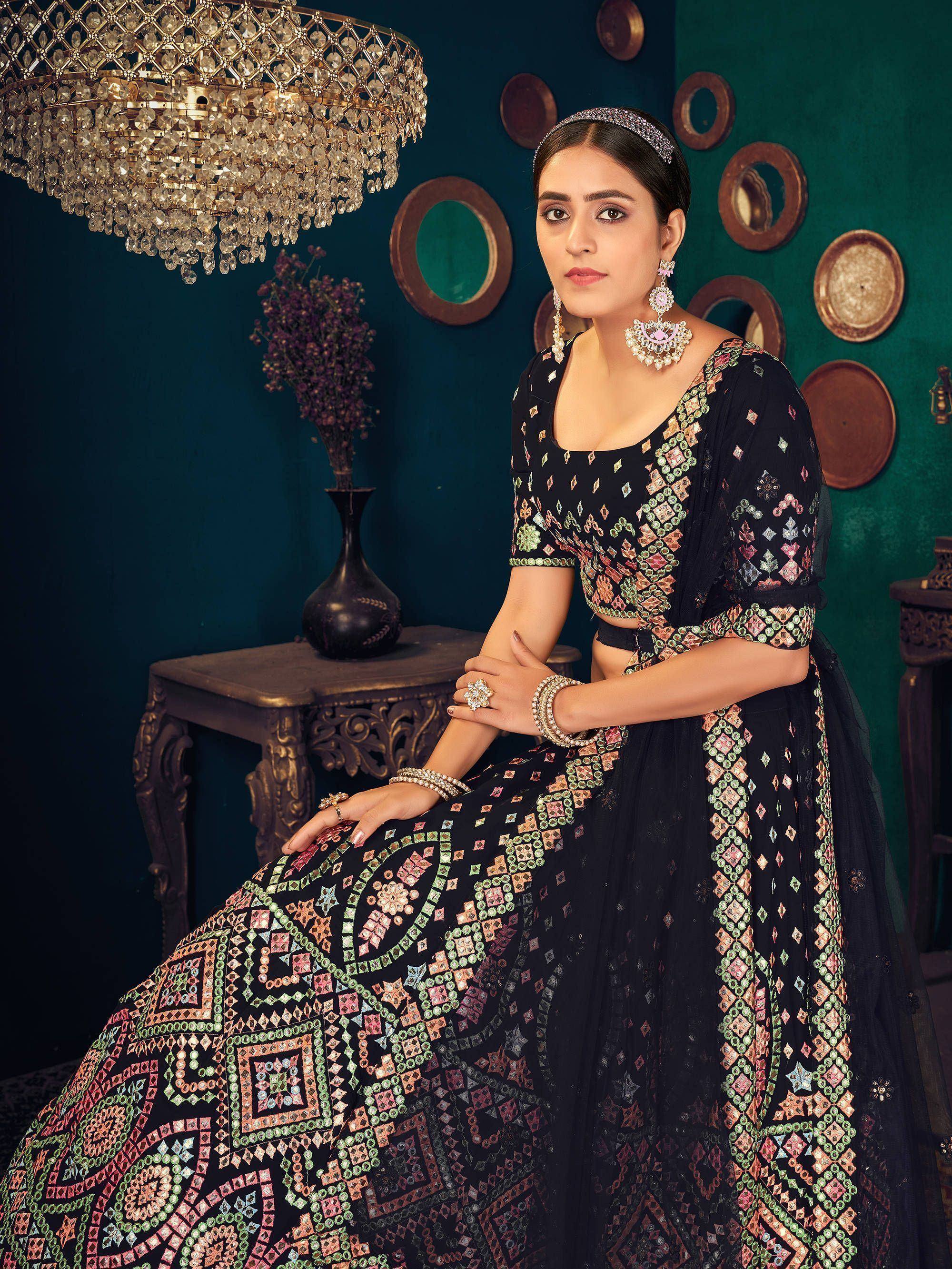 Black embroidered lehenga choli with colorful mirror work, perfect for Indian ethnic wear
