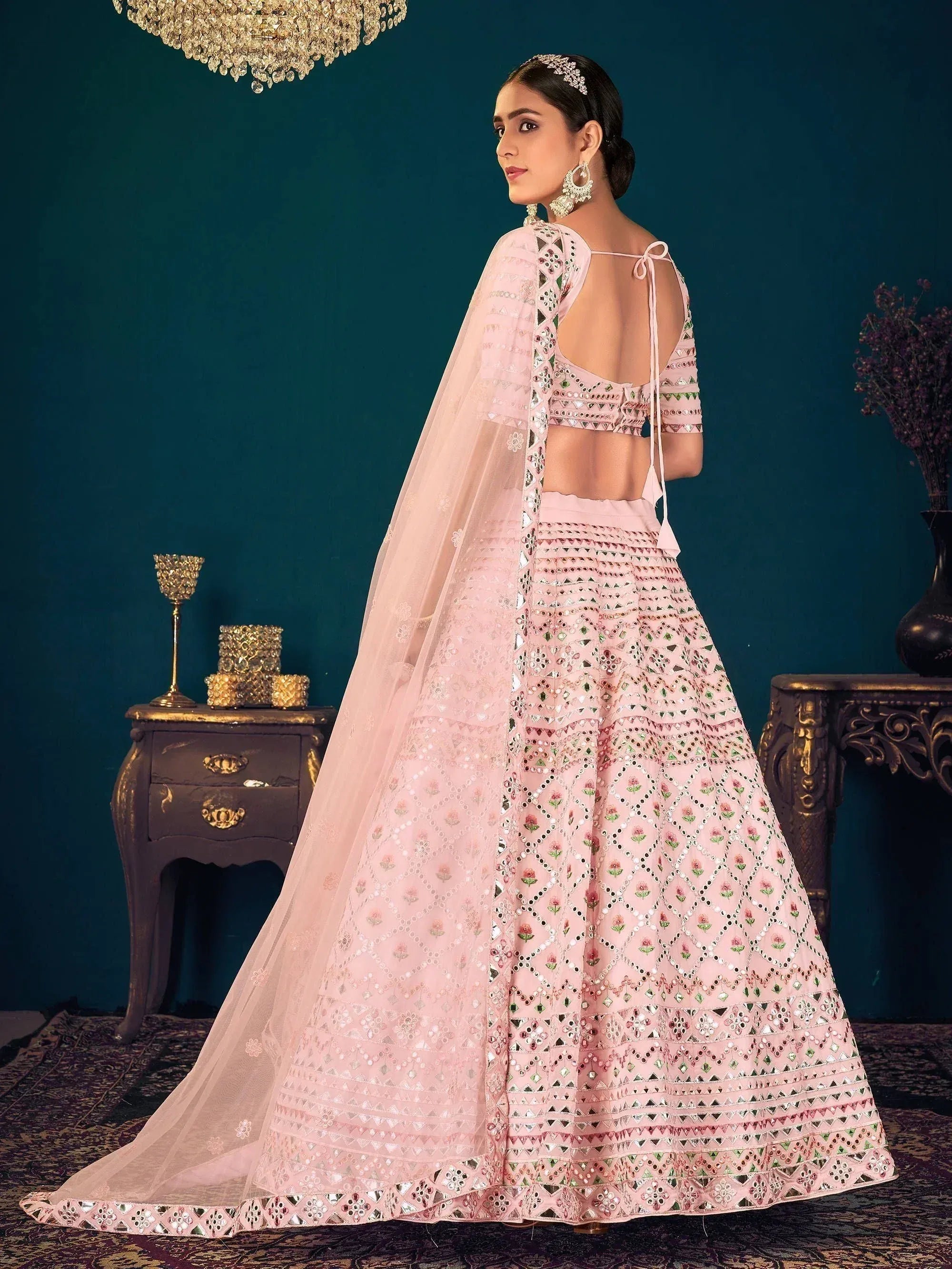 Pink embroidered lehenga choli with mirror work and sheer dupatta for Indian ethnic wear