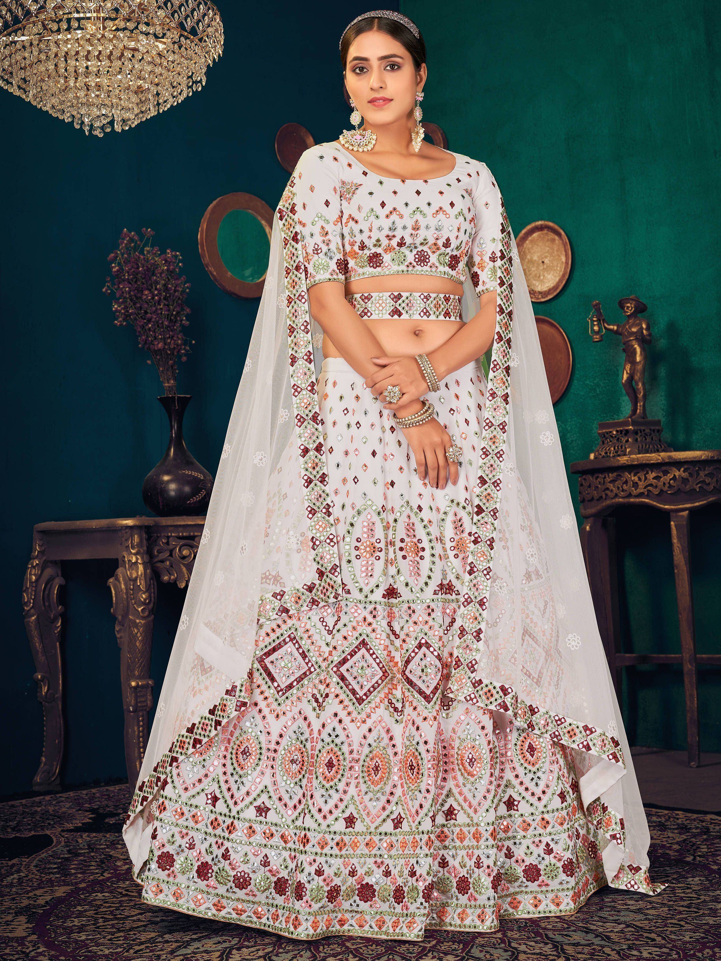 White embroidered lehenga choli with mirror work, perfect for Indian ethnic wear and festive occasions