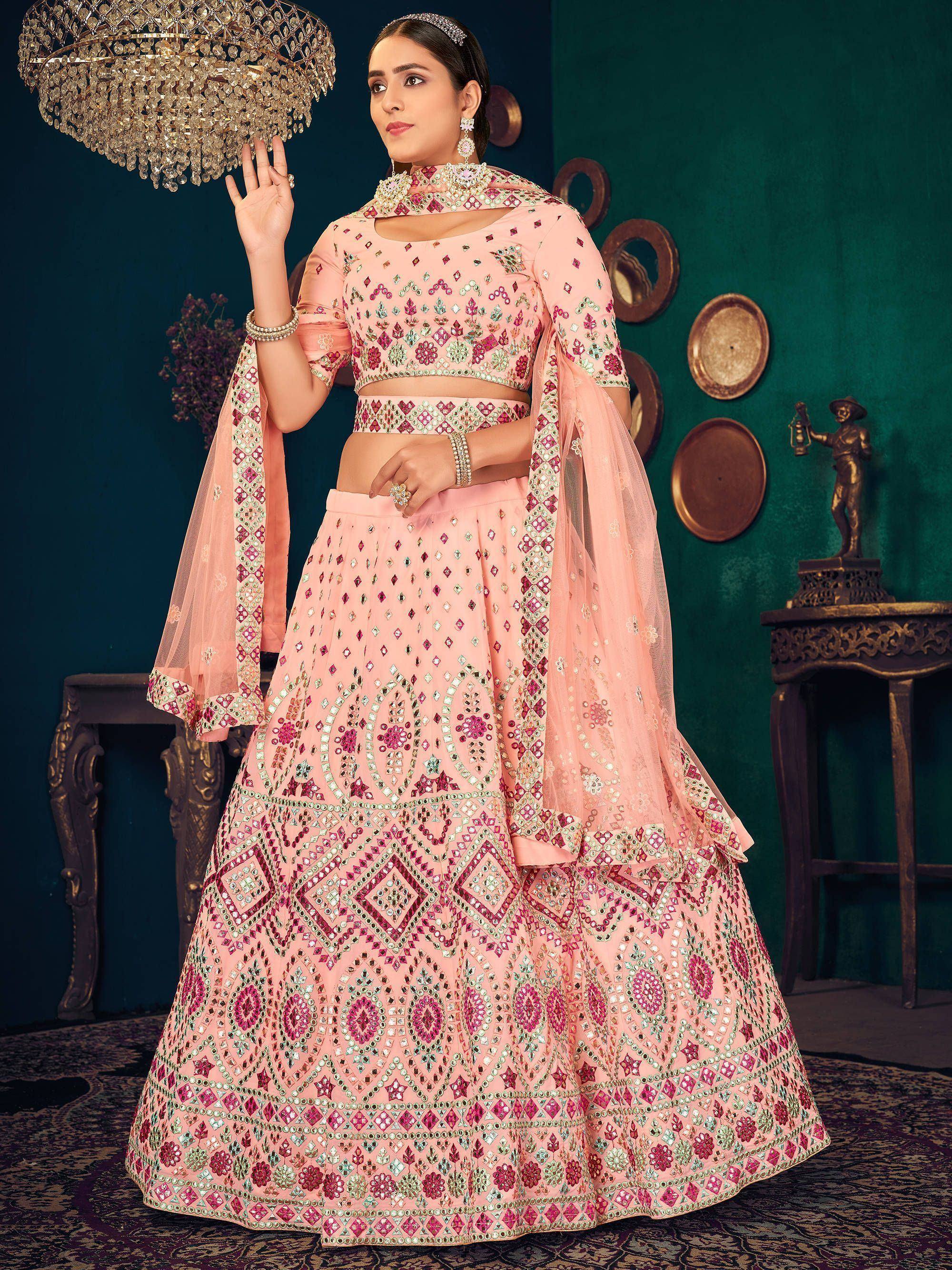 Pink mirror-work lehenga choli with floral embroidery, perfect for Indian weddings and festive occasions.