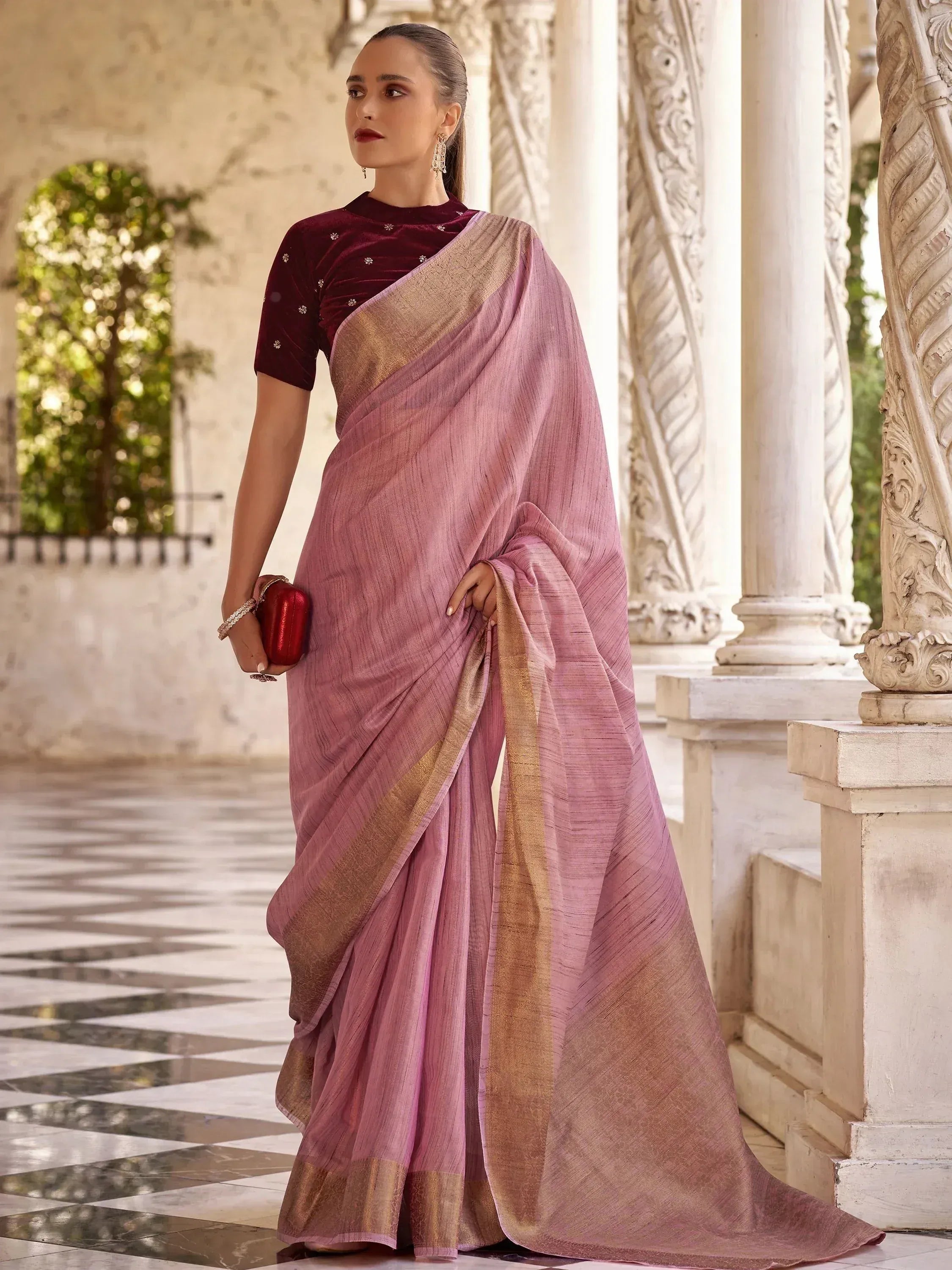 Elegant pink saree with gold border and maroon velvet blouse, perfect for Indian ethnic occasions